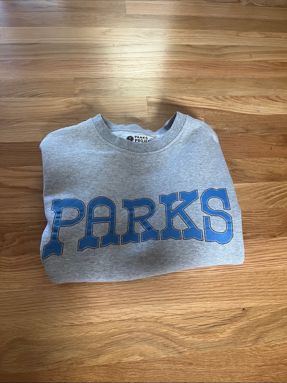 Parks Project Heather Gray Crewneck with Blue 'PARKS' Logo